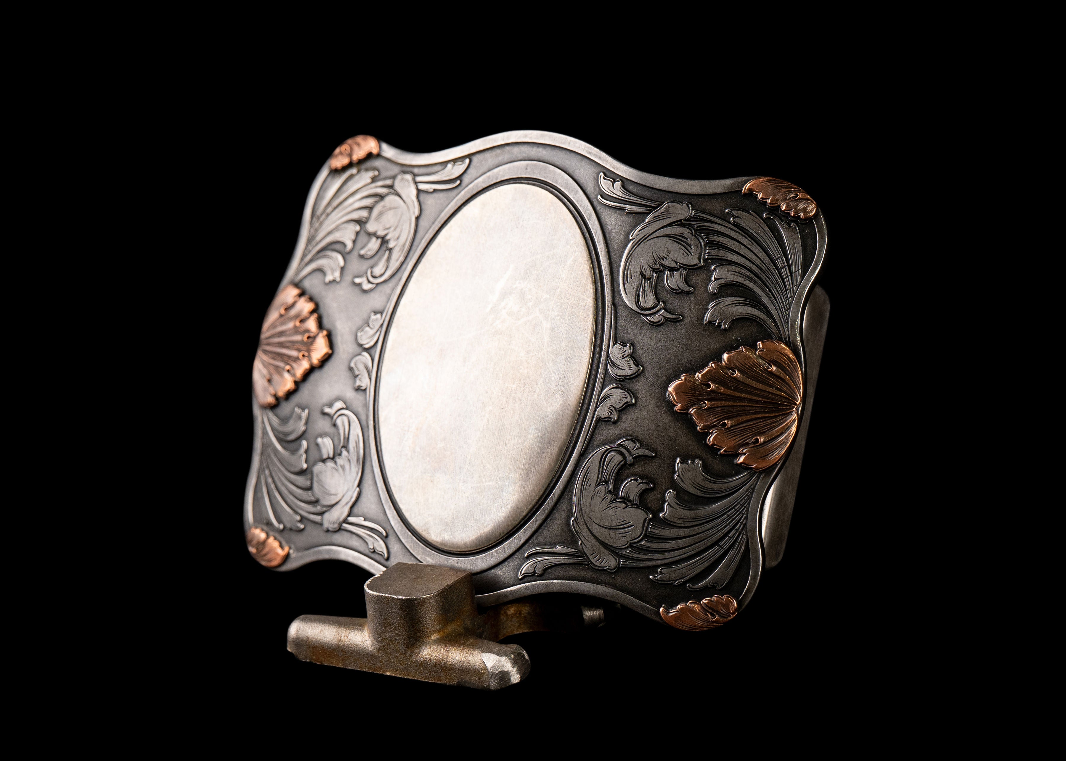 Chief Buckle Featuring Scrolling and Floral Copper Accents